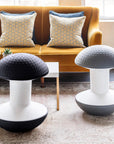 Two modern Humanscale Ballo stools with textured tops in a living room setting. In black and gray finish. Kansas City Office Design.