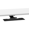 Side view of a black HumanScale keyboard tray meant for height adjustable desk. Pictured with a desk. Kansas City Office Design.