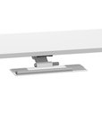 Side view of a white HumanScale keyboard tray meant for height adjustable desk. Pictured with a desk. Kansas City Office Design.