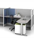 Modern office desk setup with a chair and laptop in a cubicle. Kansas City Office Design