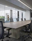 Modern office conference room with long wooden table and chairs. Kansas City Office Design.