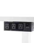 Side View of the SitOnIt Current Under mount power in Black mounted to the bottom of a top. Kansas City Office Design.