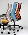 Four office chairs in different colors on a white background. Kansas City Office Design