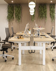Modern office meeting room with wooden tables and chairs, plants on the wall. Kansas City Office Design