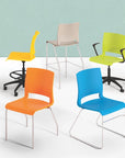 Colorful chairs including orange, blue, yellow, and green on a light background. Kansas City Office Design.