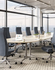 Modern conference room with gray Prava conference chairs and a large table. Kansas City Office Design