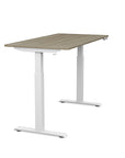 Side view of the SitonIt Switchback Height Adjustable Sit-to-Stand Desk. It has a White base with a 27"D x 54"W Sandalwood top - Kansas City Office Furniture