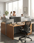 Modern office setup with desks, chairs, and people working. Kansas City Office Design