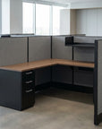 Corner office desk with gray walls and wooden top in a modern office setting. Kansas City Office Design.