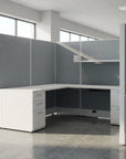 Modern office desk with gray partition walls in a bright room. Kansas City Office Design