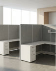 Modern office cubicles with gray partitions and white desks in a bright room. Kansas City Office Design