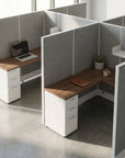 Modern office cubicles with wooden desks and gray partitions. Kansas City Office Design