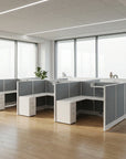 Modern AIS Divi office cubicles with glass partitions in a bright room with large windows. Kansas City Office Furniture