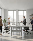 HAT Collective Height adjustable 4pod with Silver Base and Designer White Tops with people working in an open office. Kansas City Office Design