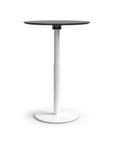 Humanscale Float Gather 30" Round Table in white Base with black laminate Top in standing position. Kansas City Office Design.