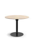 Humanscale Float Gather 36" round Table in black base with white oak veneer top in sitting position. Kansas City Office Design.
