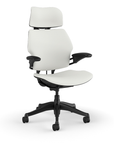 Side view of the HumanScale Freedom with Headrest in a white polyurethane fabric with black frame. Kansas City Office Furniture.