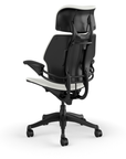 Back view of the HumanScale Freedom with Headrest in a white polyurethane fabric with black frame. Kansas City Office Furniture.