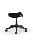 Side view of a Humanscale Pony Stool with 5" standard cylinder, black fabric saddle seat and graphite frame. Kansas City Office Design.