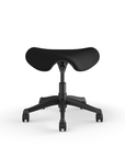 Front view of a Humanscale Saddle Stool with 5" standard cylinder, wipeable lotus black fabric saddle seat and graphite frame. Kansas City Office Design.
