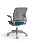 Humanscale World Chair with black mesh, grey frame, peacock blue fabric, back view. Kansas City Office Design