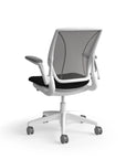 Humanscale World Chair with black mesh, white frame, black polyurethane lotus fabric seat, back view. Kansas City Office Design