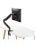 Back view of the SitOnIt Mobi Single Monitor Arm in Black mounted to the Reya Home Desk. Kansas City Office Design.