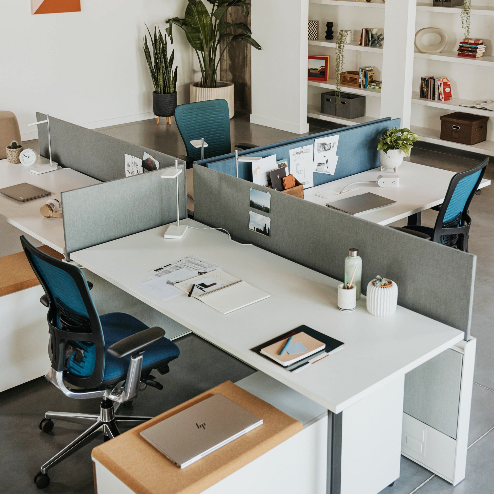 Project & Installation Services for a open office setup with desks, chairs, and office supplies in a bright room. Kansas City Office Furniture.