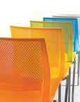 Colorful office chairs with mesh backs on a white background. Kansas City Office Design.
