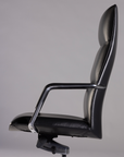 Black office chair on a gray background. Kansas City Office Design