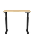 Front view of the SitonIt Switchback Height Adjustable Sit-to-Stand Desk. It has a Black base with a 24"D x 42"W Maple top - Kansas City Office Furniture