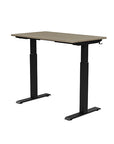 Back view of the SitonIt Switchback Height Adjustable Sit-to-Stand Desk. It has a Black base with a 24"D x 42"W Sandalwood top - Kansas City Office Furniture