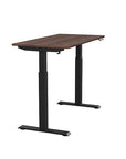 Side view of the SitonIt Switchback Height Adjustable Sit-to-Stand Desk. It has a Black base with a 24"D x 48"W Walnut top - Kansas City Office Furniture