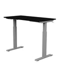 Back view of the SitonIt Switchback Height Adjustable Sit-to-Stand Desk. It has a Silver base with a 24"D x 48"W Black top - Kansas City Office Furniture