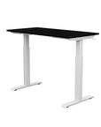 Back view of the SitonIt Switchback Height Adjustable Sit-to-Stand Desk. It has a White base with a 24"D x 48"W Black top - Kansas City Office Furniture