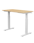 Back view of the SitonIt Switchback Height Adjustable Sit-to-Stand Desk. It has a White base with a 24"D x 48"W Maple top - Kansas City Office Furniture