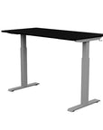 Back view of the SitonIt Switchback Height Adjustable Sit-to-Stand Desk. It has a Silver base with a 27"D x 54"W Black top - Kansas City Office Furniture