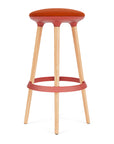 Via Joi Bar stool with orange seat, Red Poly trim, and wood base on a white background. Kansas City Office Design.