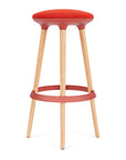 Via Joi Bar stool with Red seat, red Poly trim, and wood base on a white background. Kansas City Office Design.