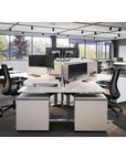 Corporate office space styled with Bolton Black Mesh Mid-Back Task Chairs, Dual Monitor Arms, height adjustable desks, naturally lit modern workspace. Kansas City office furniture.