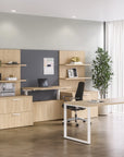 Modern office setup with wooden furniture, desk, and shelves. Kansas City Office Design.