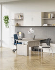 Modern office setup with a desk, chairs, and shelves. Kansas City Office Design.