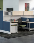 Modern office setup with blue and white partitioned workstations. Kansas City Office Design