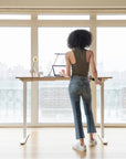 Humanscale eFloat Go 2.0 Sit-Stand Desk with bamboo top and white base in the standing position – Kansas City Office Design