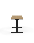 Side view of the Humanscale eFloat Go 2.0 Sit-Stand Desk with bamboo top and black base – Kansas City Office Design