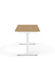 Side view of the Humanscale eFloat Go 2.0 Sit-Stand Desk with bamboo top and white base – Kansas City Office Design