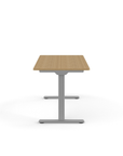 Side view of the Humanscale eFloat Go 2.0 Sit-Stand Desk with bamboo top and silver base – Kansas City Office Design