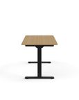 Side view of the Humanscale eFloat Go 2.0 Sit-Stand Desk with bamboo top and black base – Kansas City Office Design