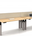 Modern office power bench sit to stand desk with partition and laptop on a white background. Configured in a single run. Kansas City Office Design.