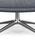 Close-up of a chair with a gray cushioned seat and polished aluminum star-shaped base on a white background. Kansas City Office Design.